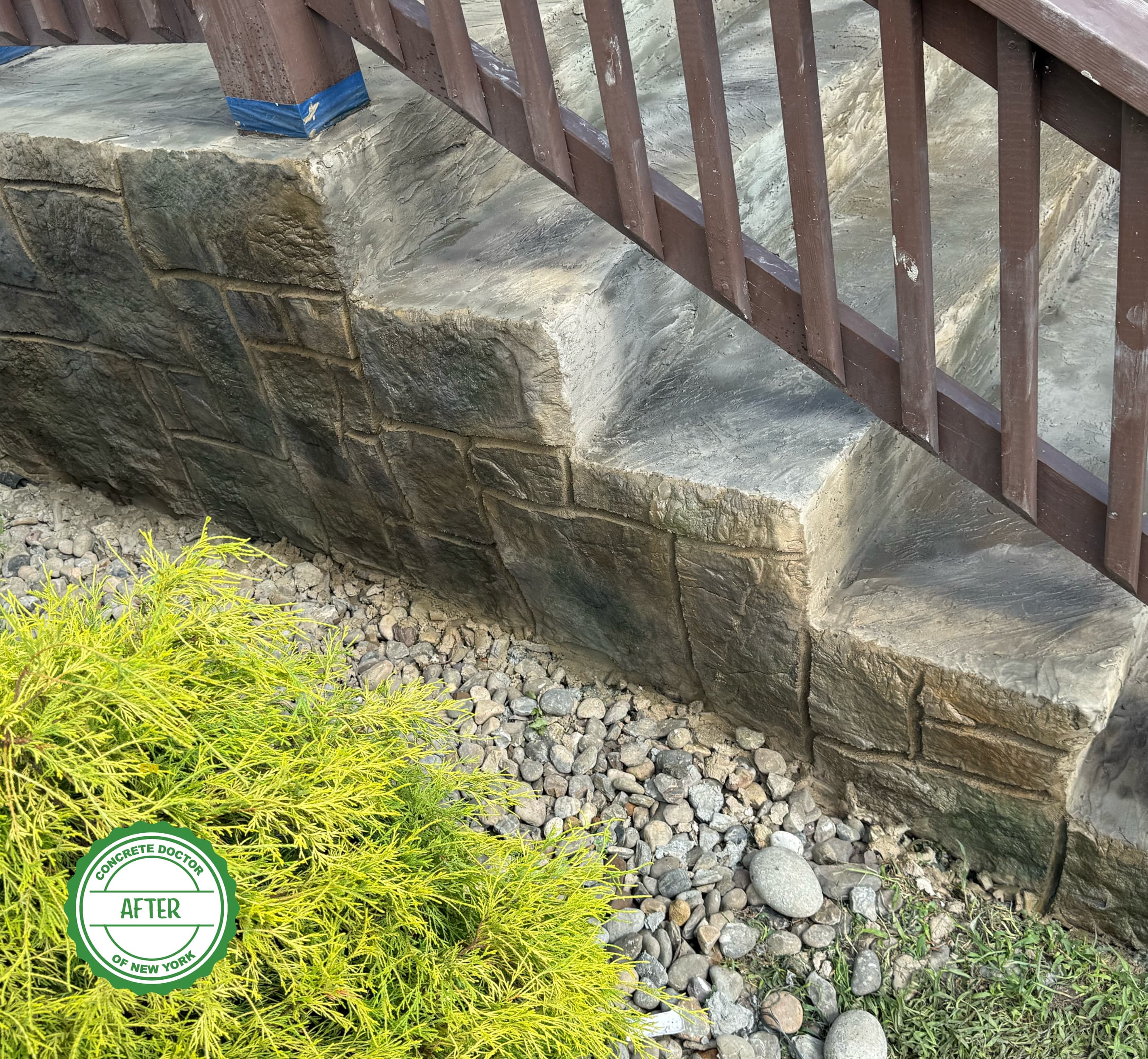 Finished stone steps repaired with carbon fiber reinforcement and a concrete overlay