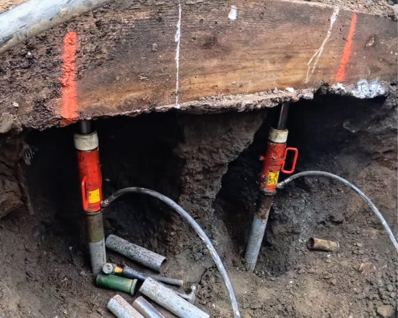 Stabil-Loc push piers being driven beneath the foyer footing during foundation repair in Pawling, NY