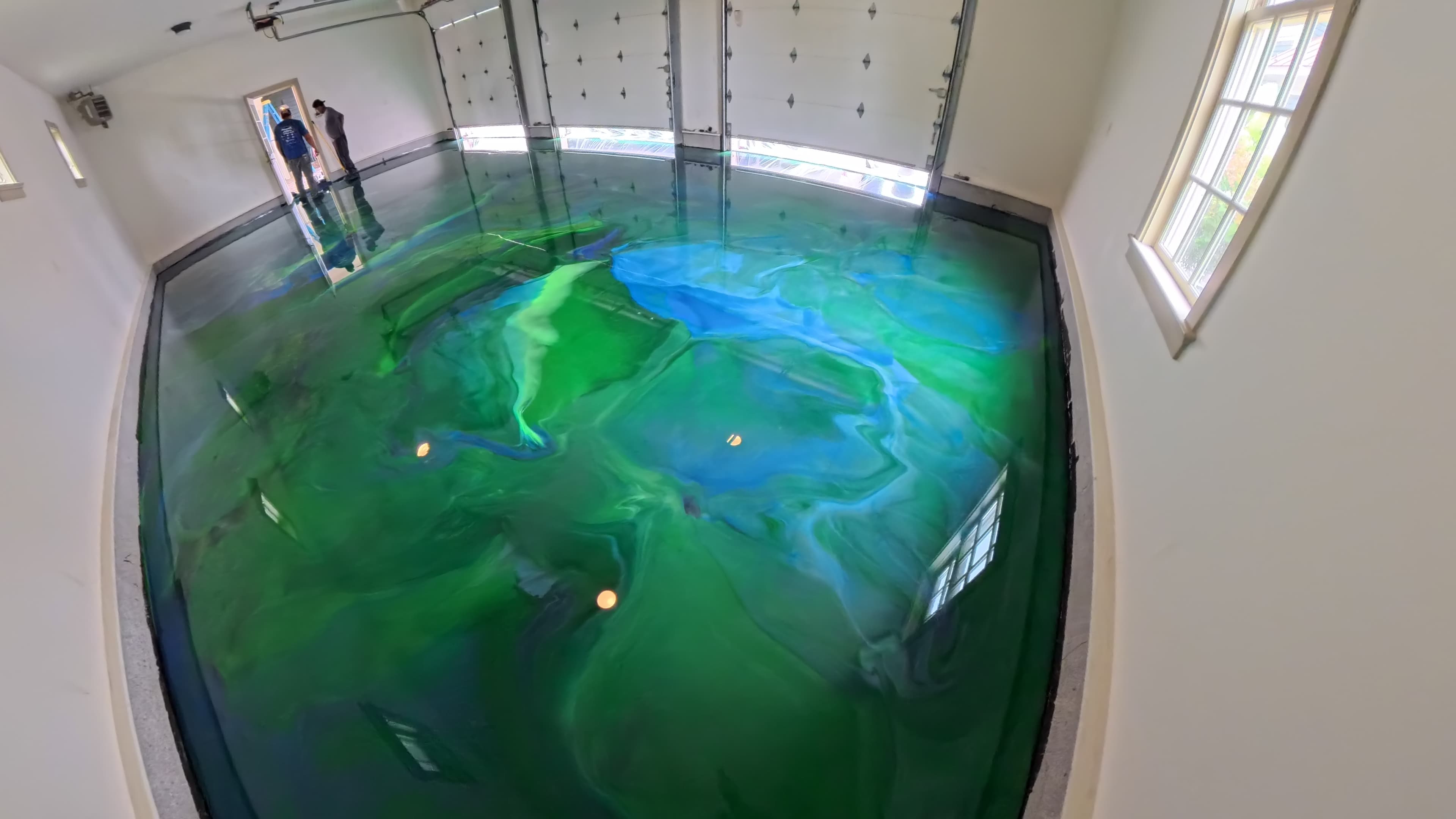 Finished blue and green metallic epoxy garage floor in Amenia, NY