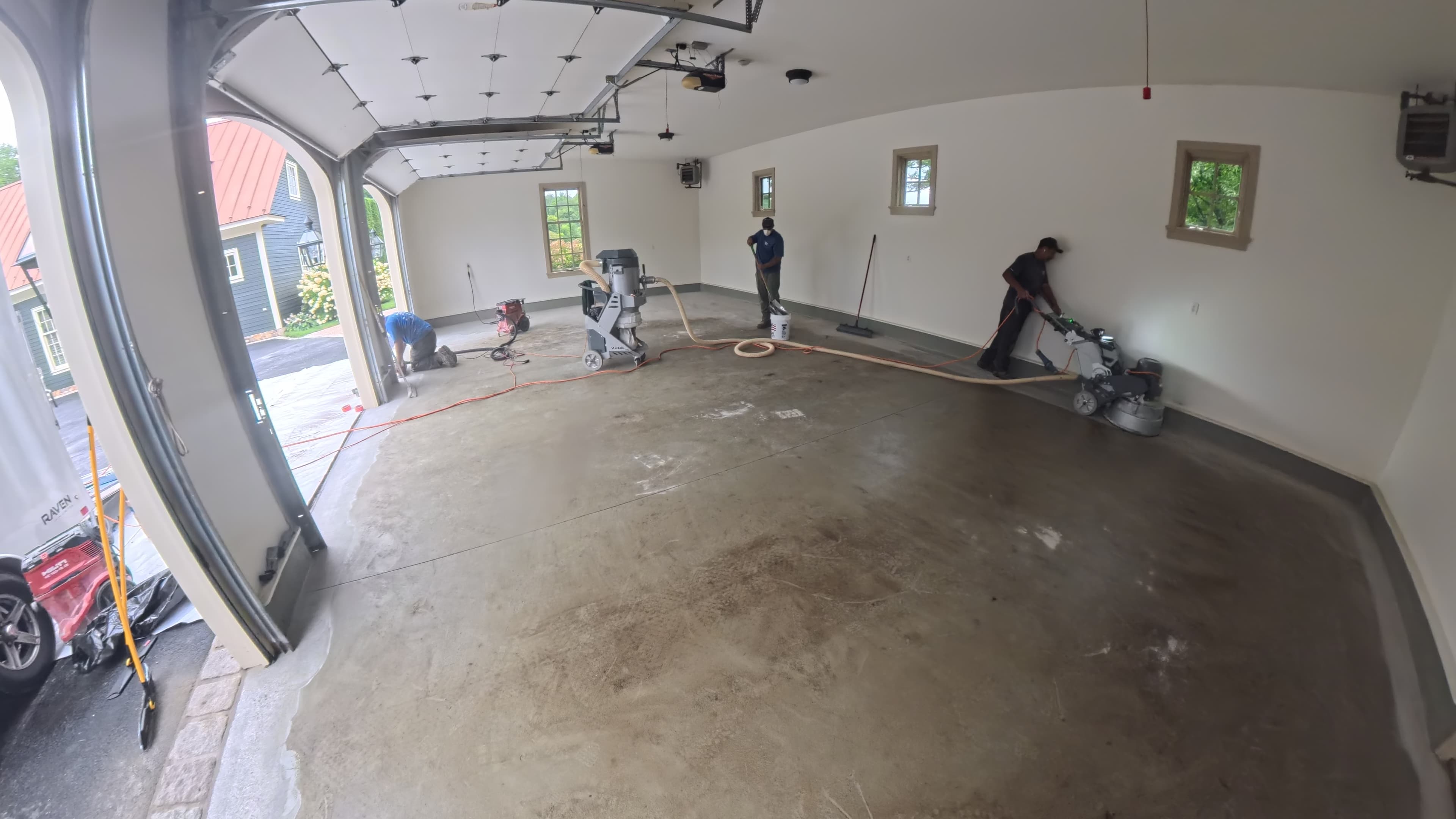 Crew mechanically grinding the garage floor to a CSP-3 profile in Amenia, NY