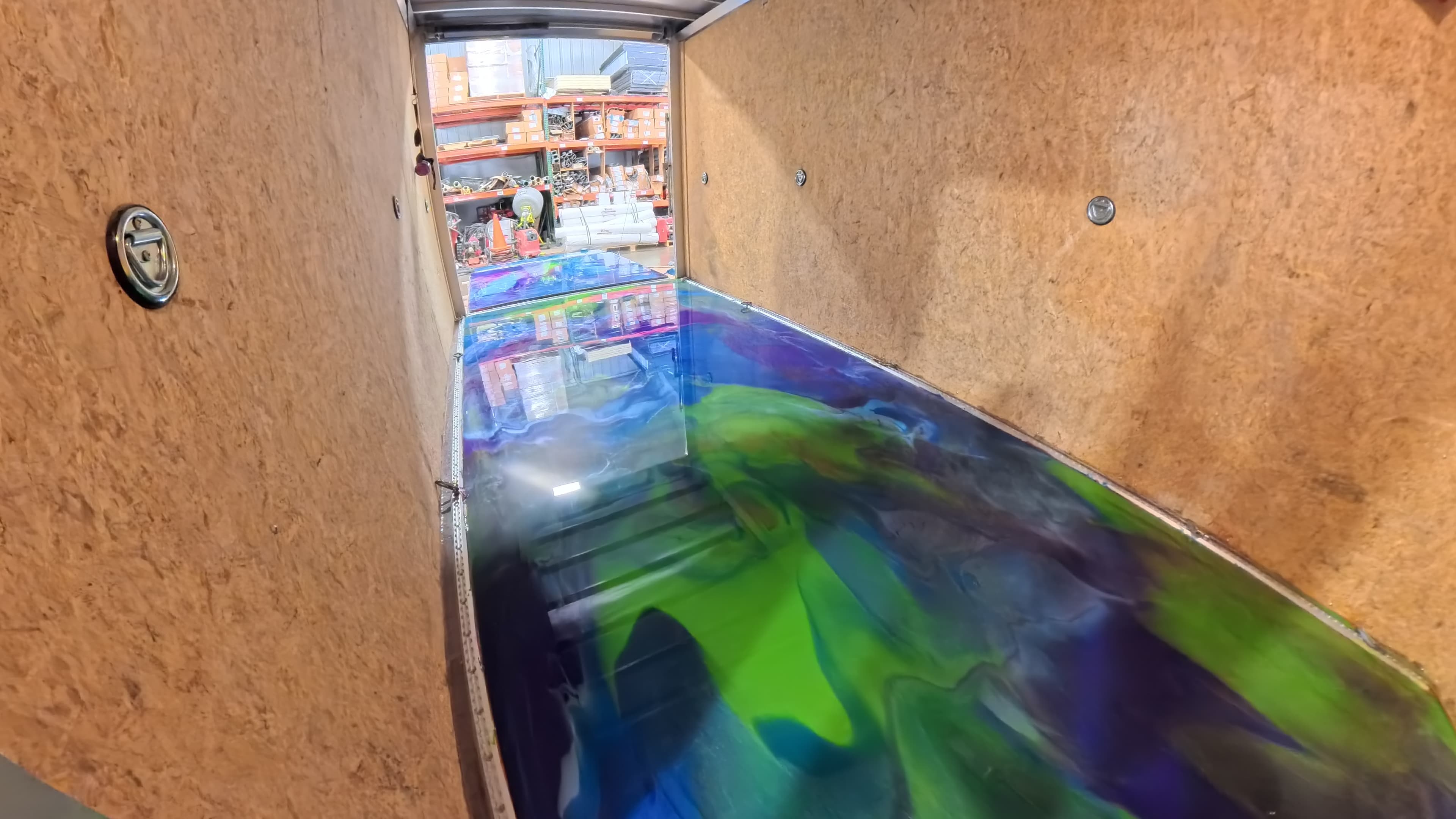 Finished blue, purple, and green swirl epoxy trailer floor in Bullville, NY