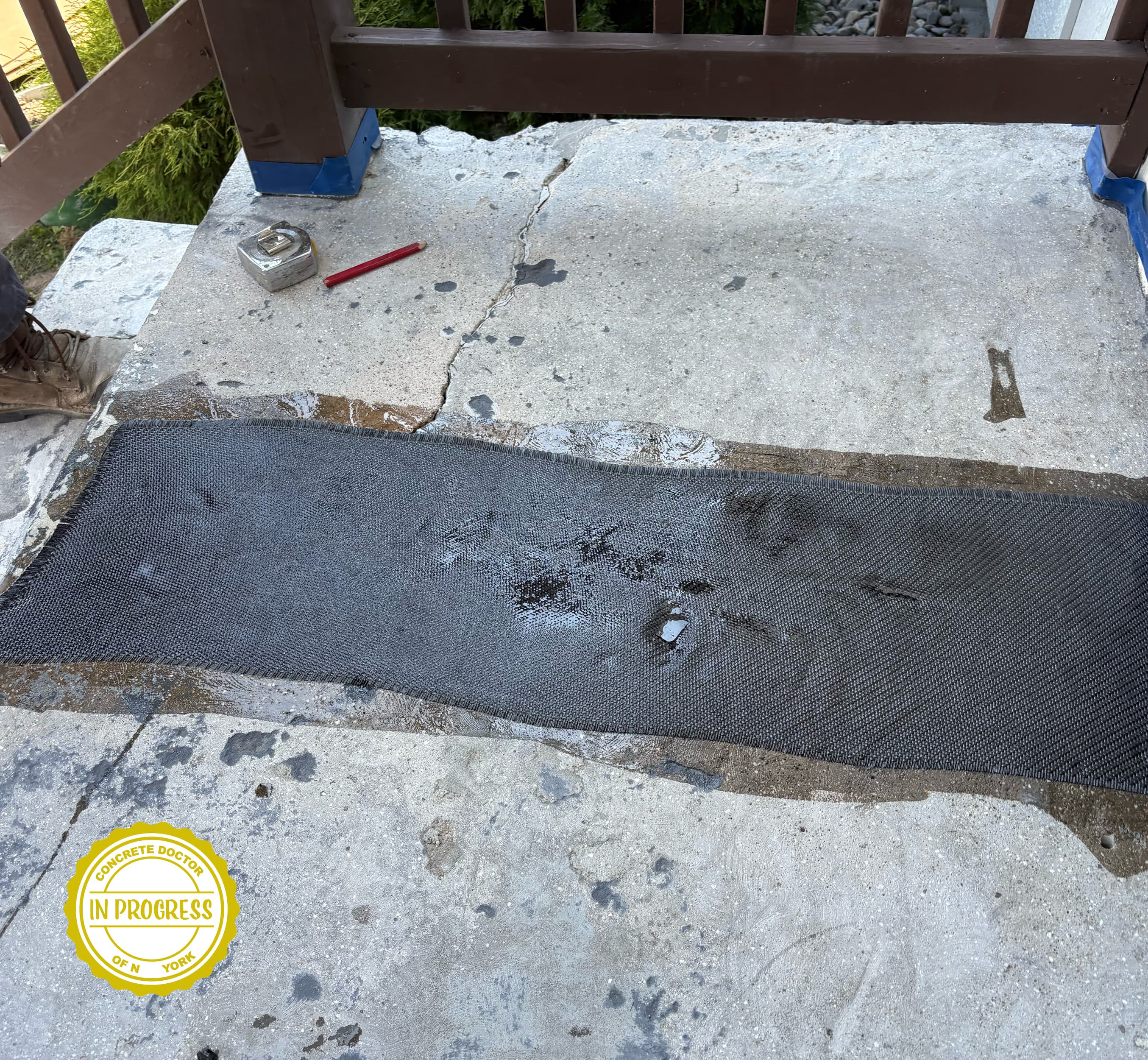 Stone step repair detail showing the stacked-stone concrete overlay pattern