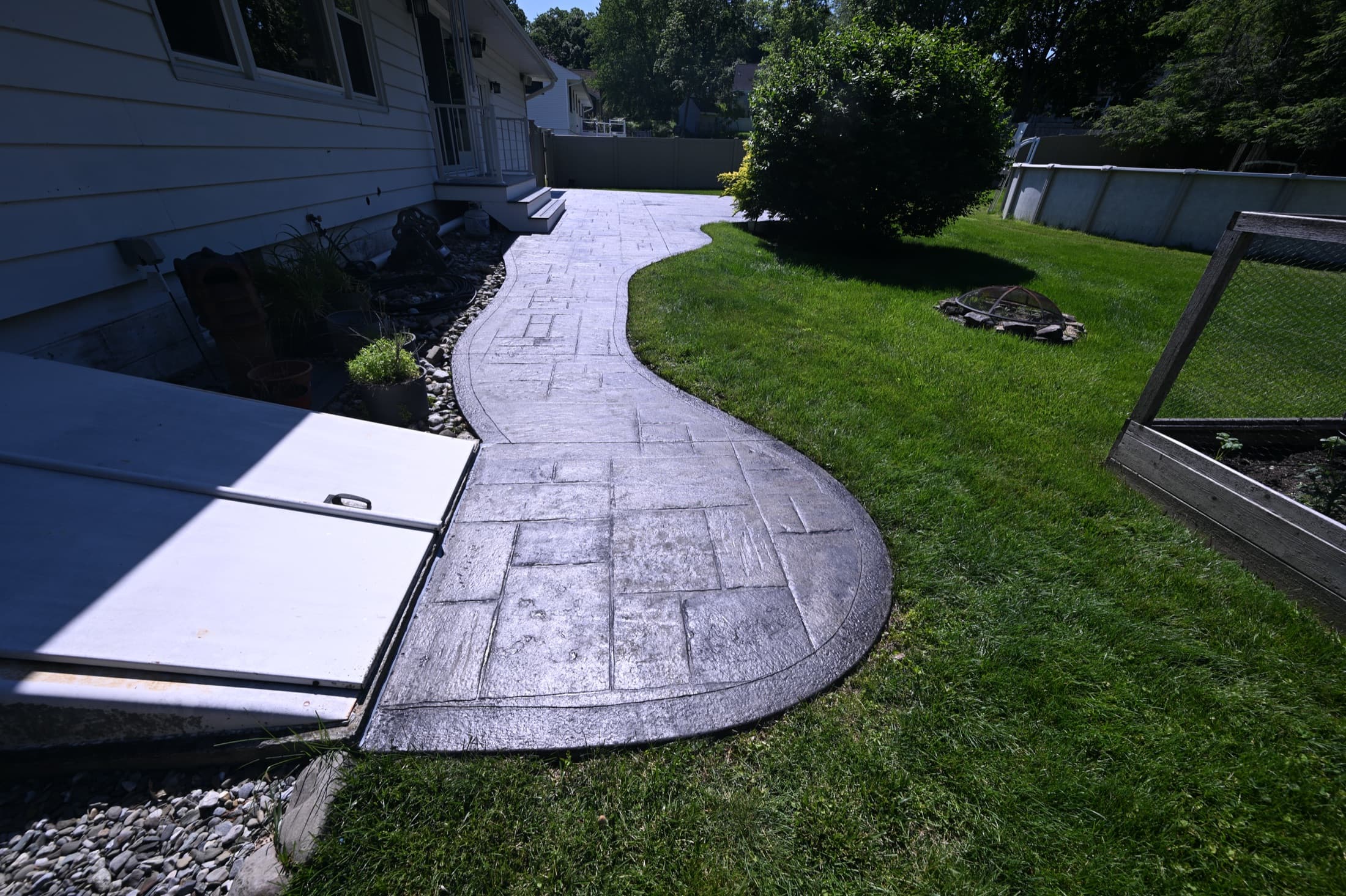 Restored stamped concrete walkway with rich color and full protective seal in Poughkeepsie, NY
