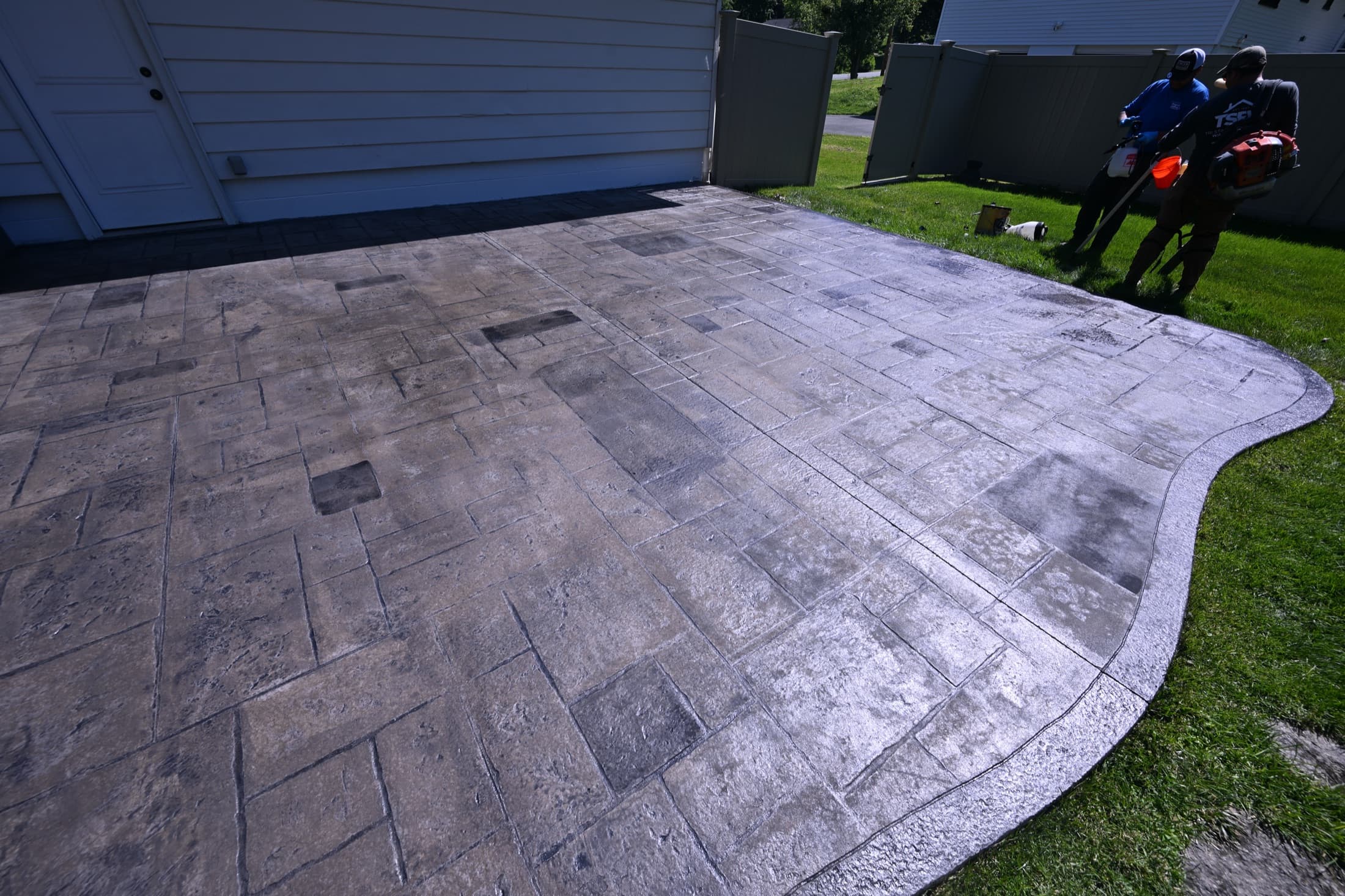 Stamped concrete patio with rich antiquing and color, freshly sealed, in Poughkeepsie, NY