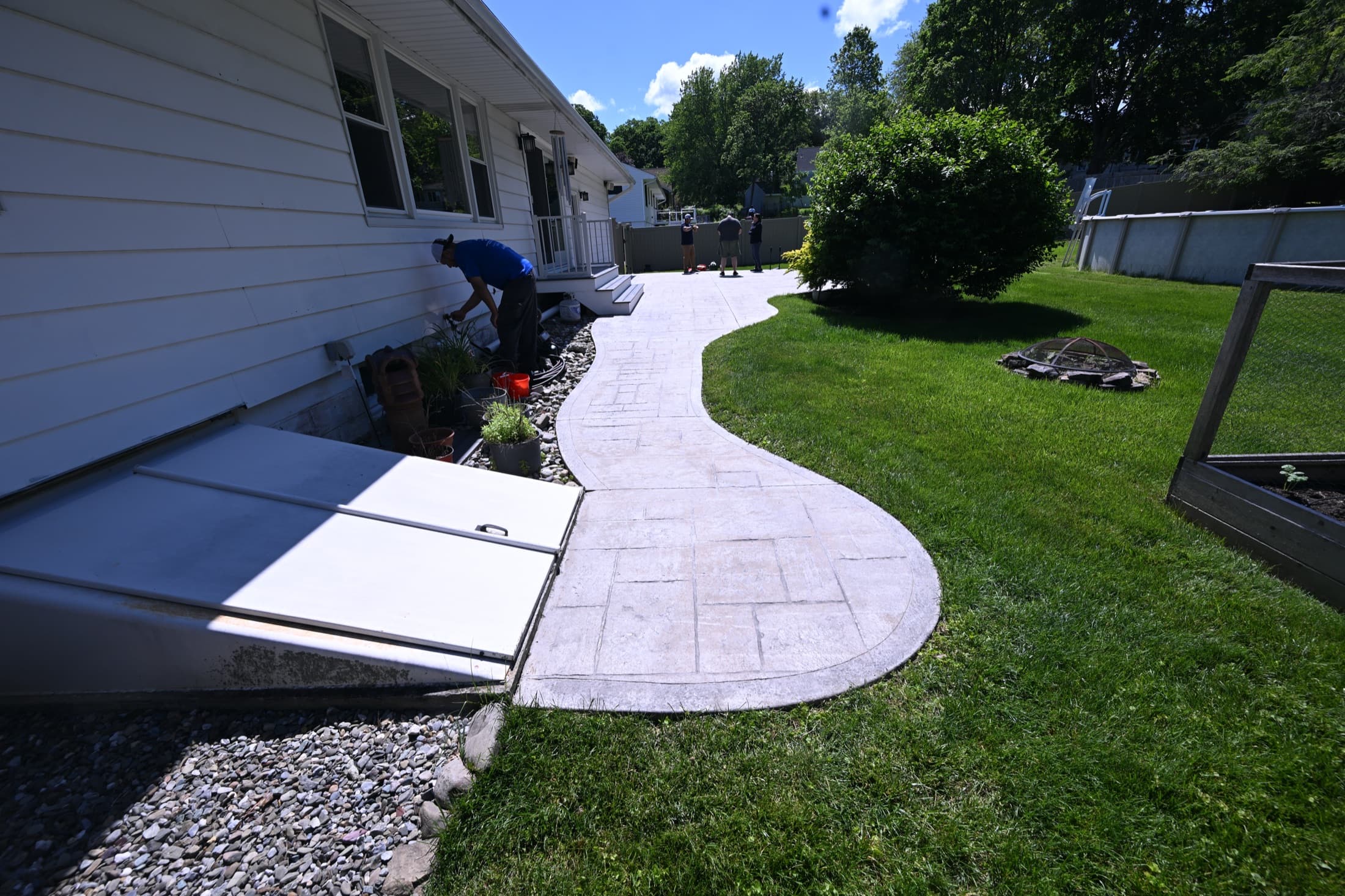 Faded stamped concrete walkway before antiquing and color treatment in Poughkeepsie, NY