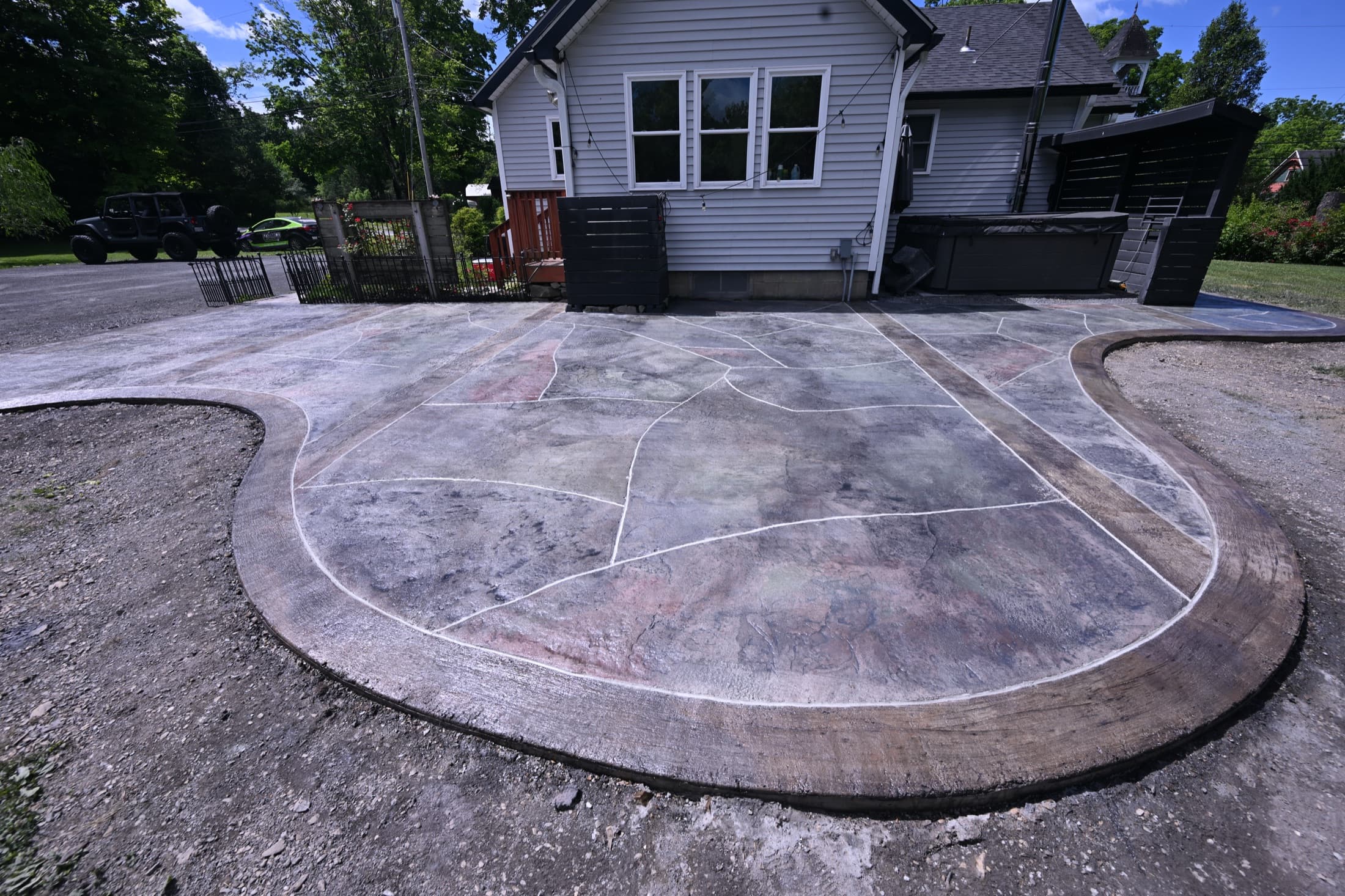 Finished custom stamped concrete patio with a distressed wood and stone pattern in New Paltz, NY