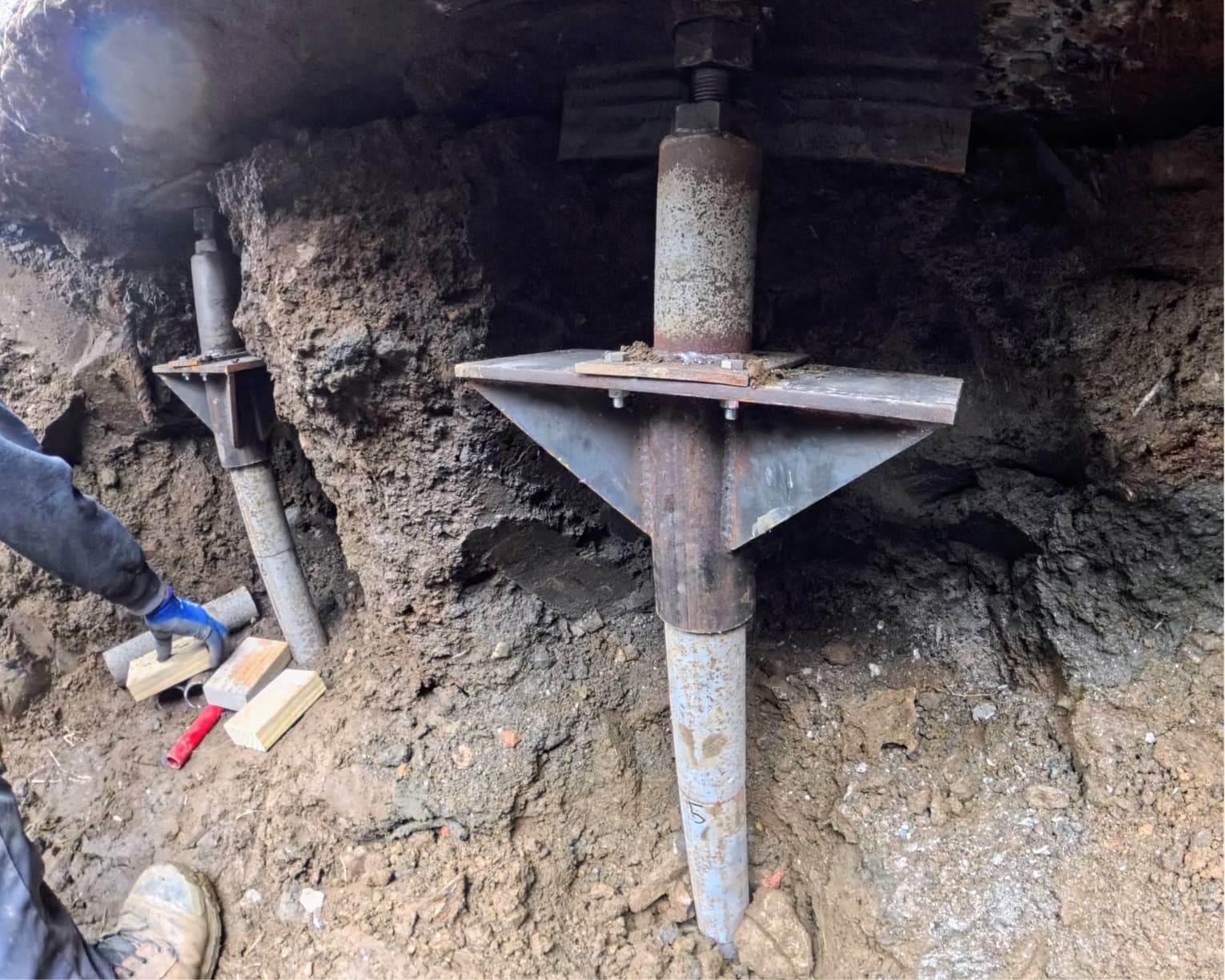 Precision-engineered push pier head assembly supporting the foyer foundation in Pawling, NY
