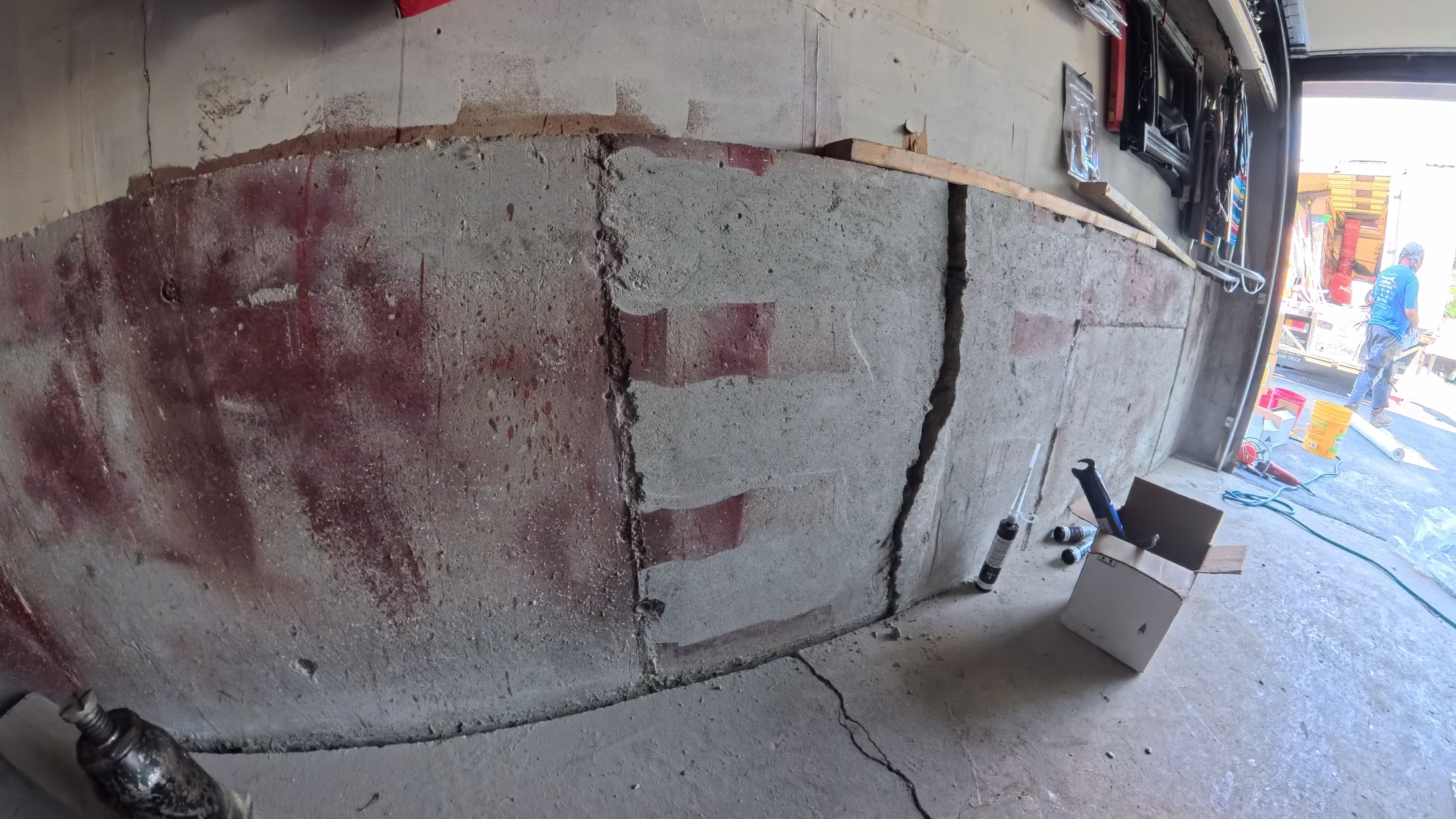 Cracked and bowing interior garage wall before crack injection in Washingtonville, NY