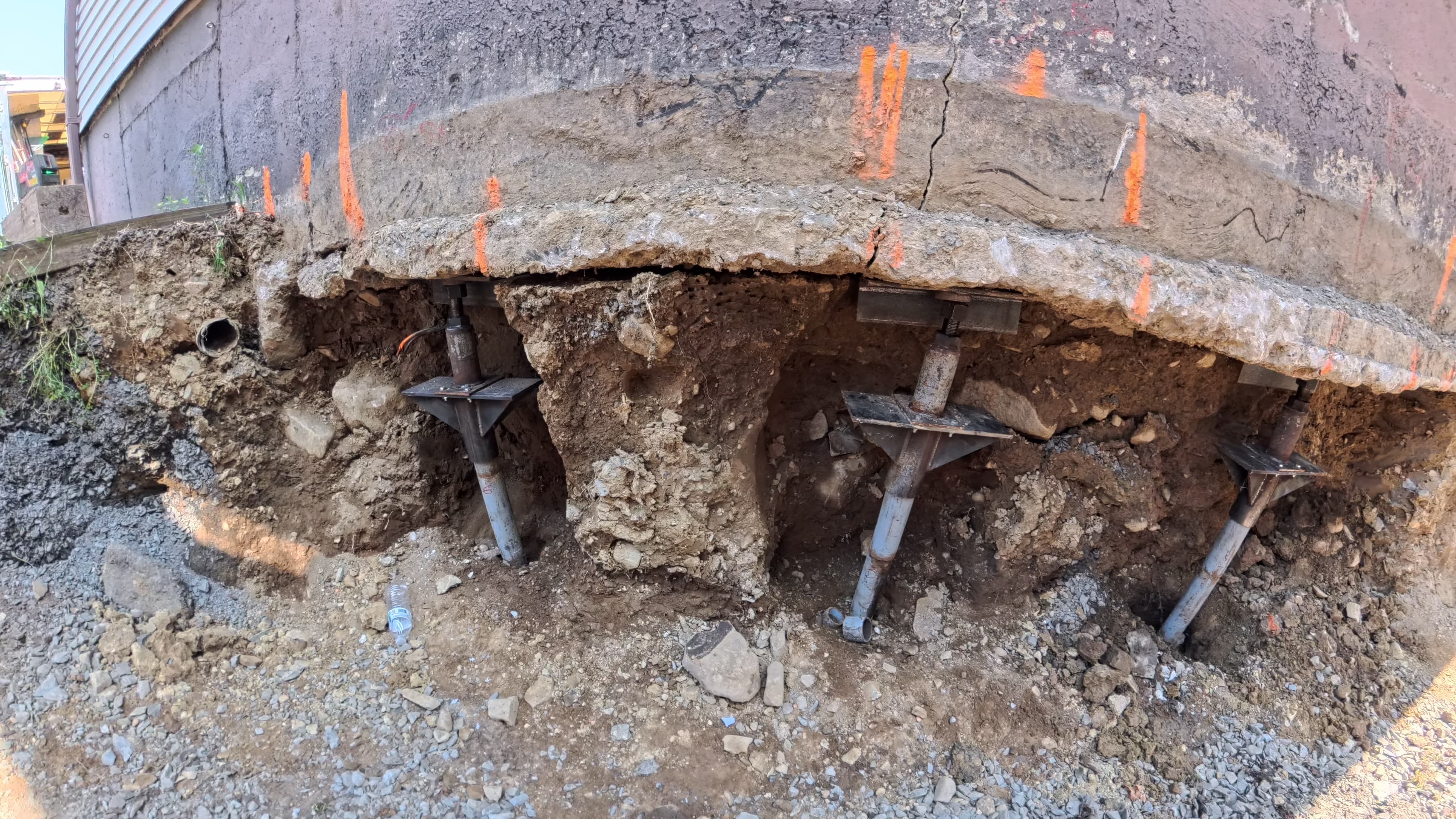 Three Stabil-Loc push piers and head assemblies installed beneath the garage footing in Washingtonville, NY