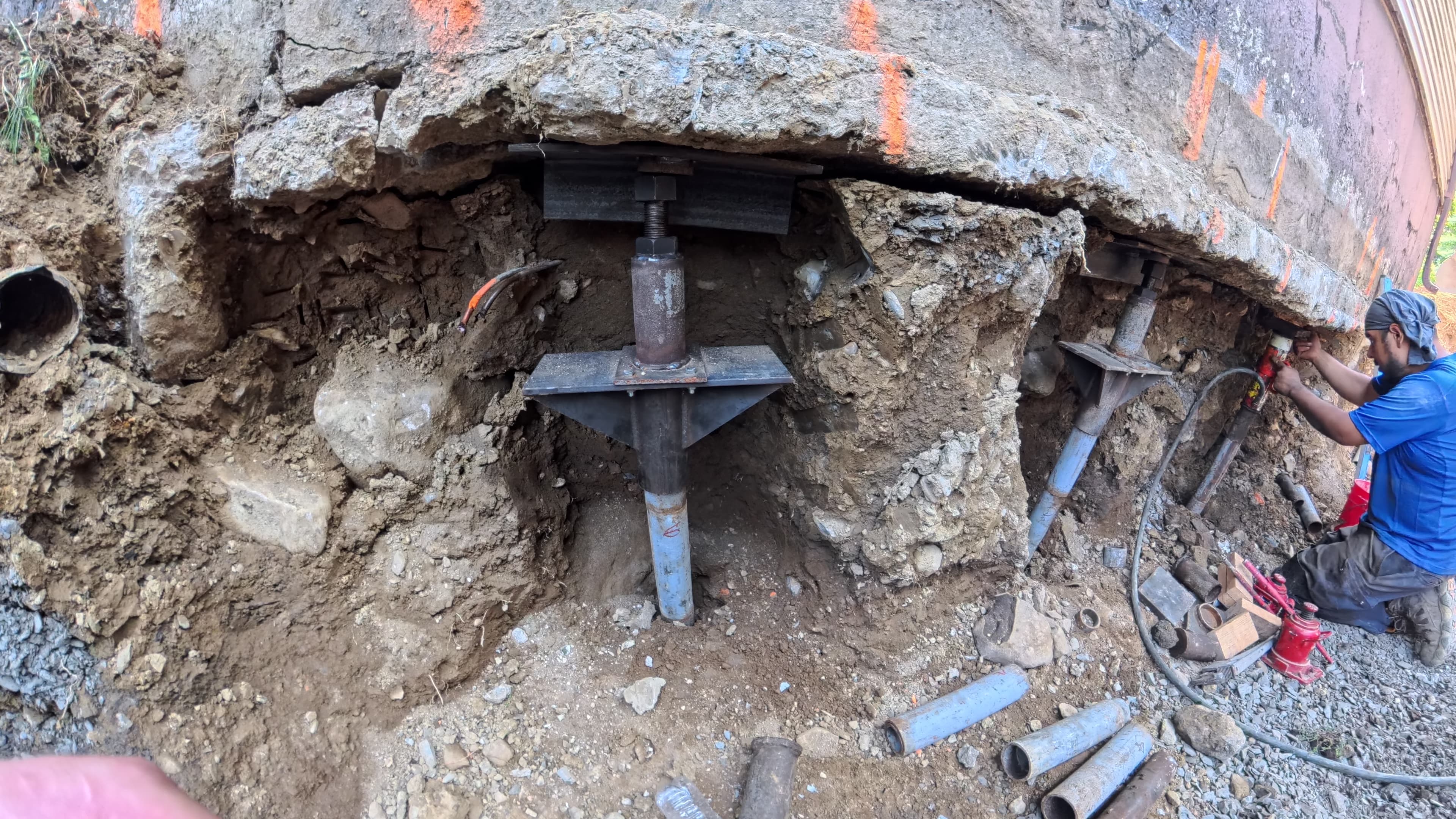 Close-up of a Stabil-Loc push pier bracket beneath the garage foundation in Washingtonville, NY