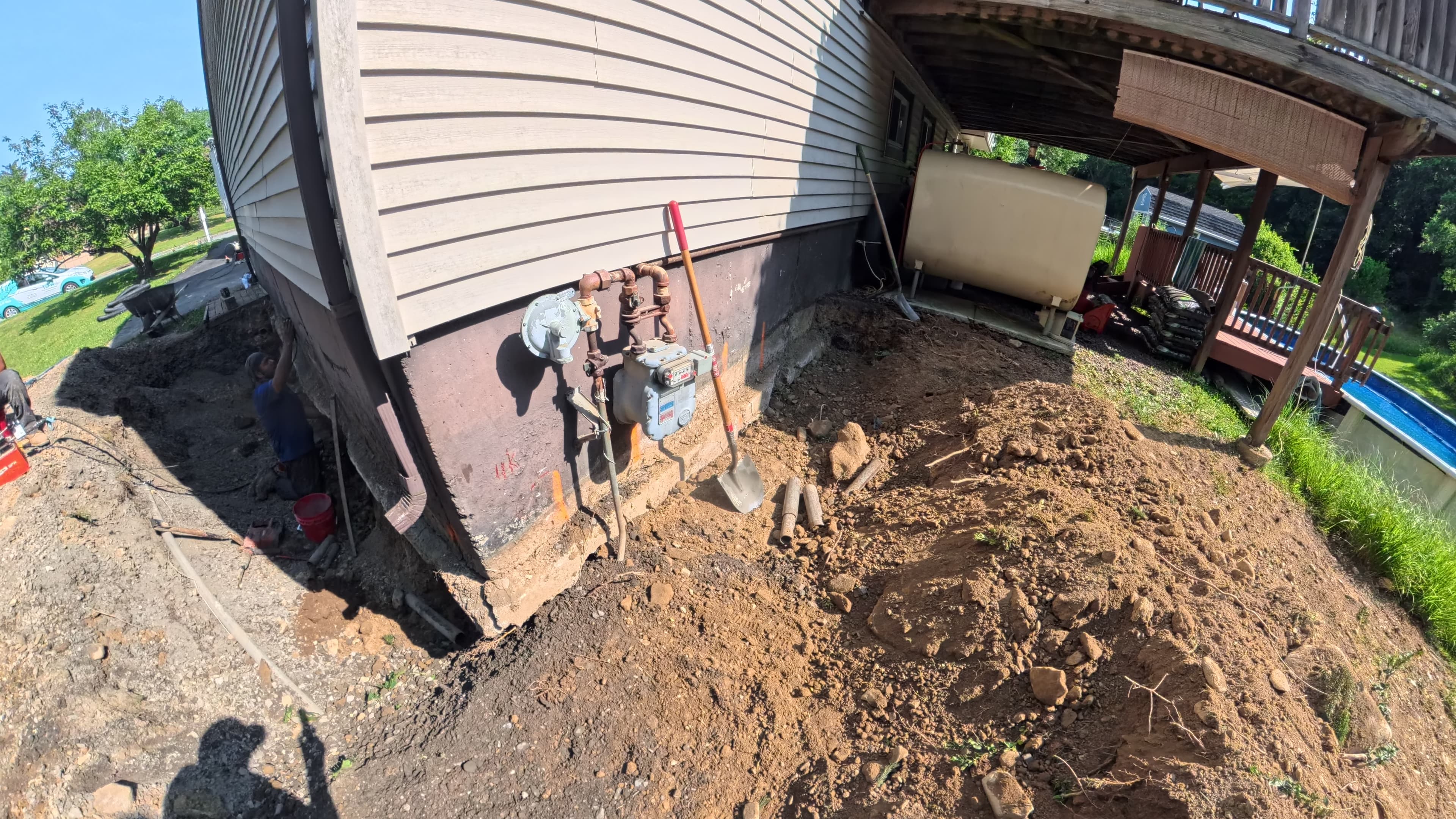 Excavated garage foundation exposed for push pier installation in Washingtonville, NY