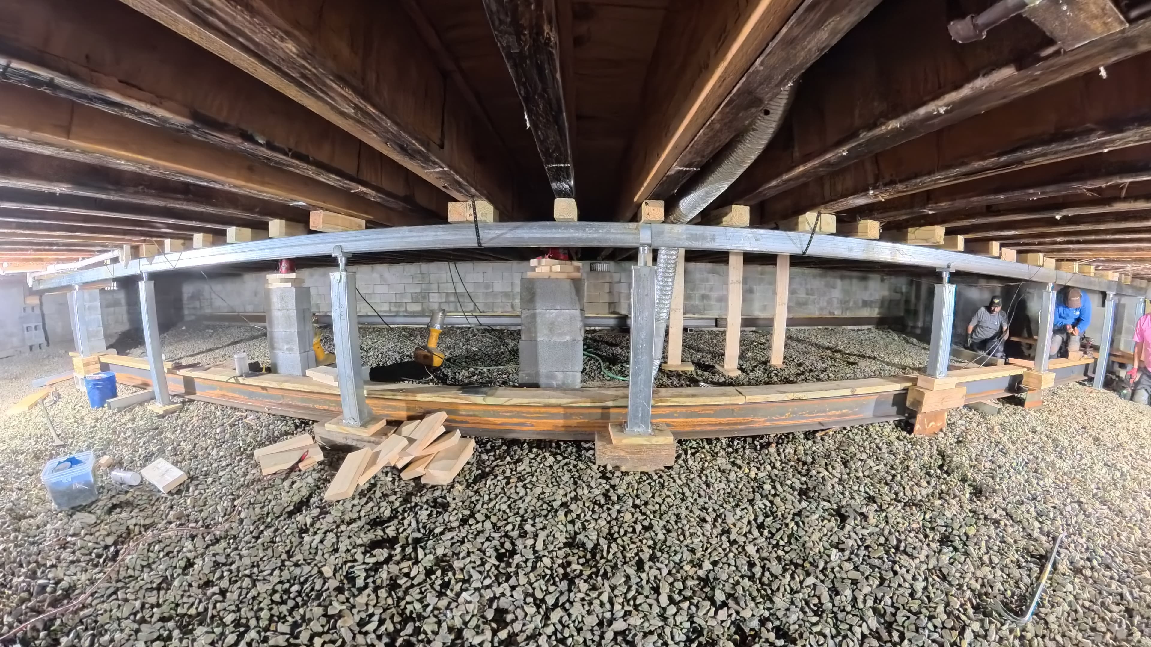 New steel I-beam girder on adjustable steel supports beneath the camp infirmary in Barryville, NY