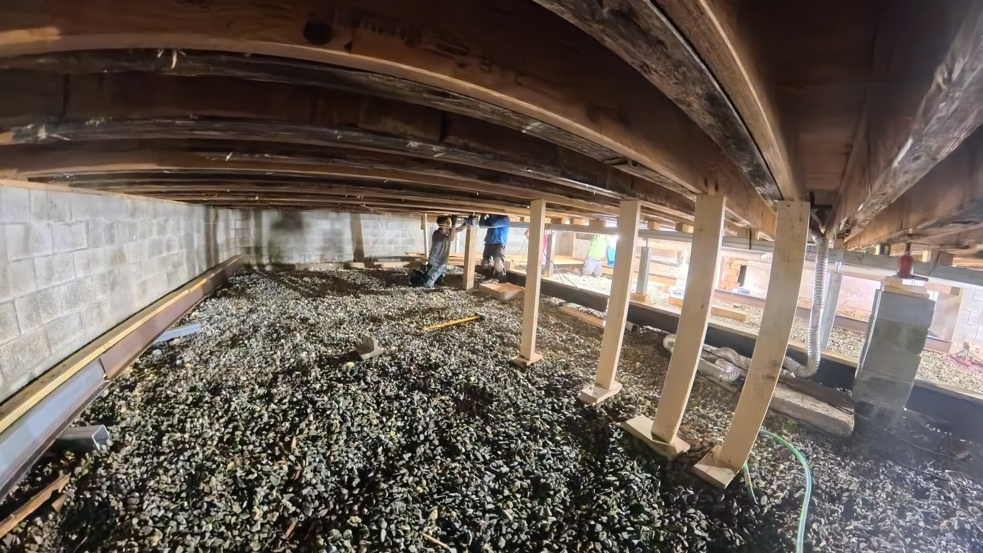 Crew installing temporary shoring beneath the infirmary joists in Barryville, NY