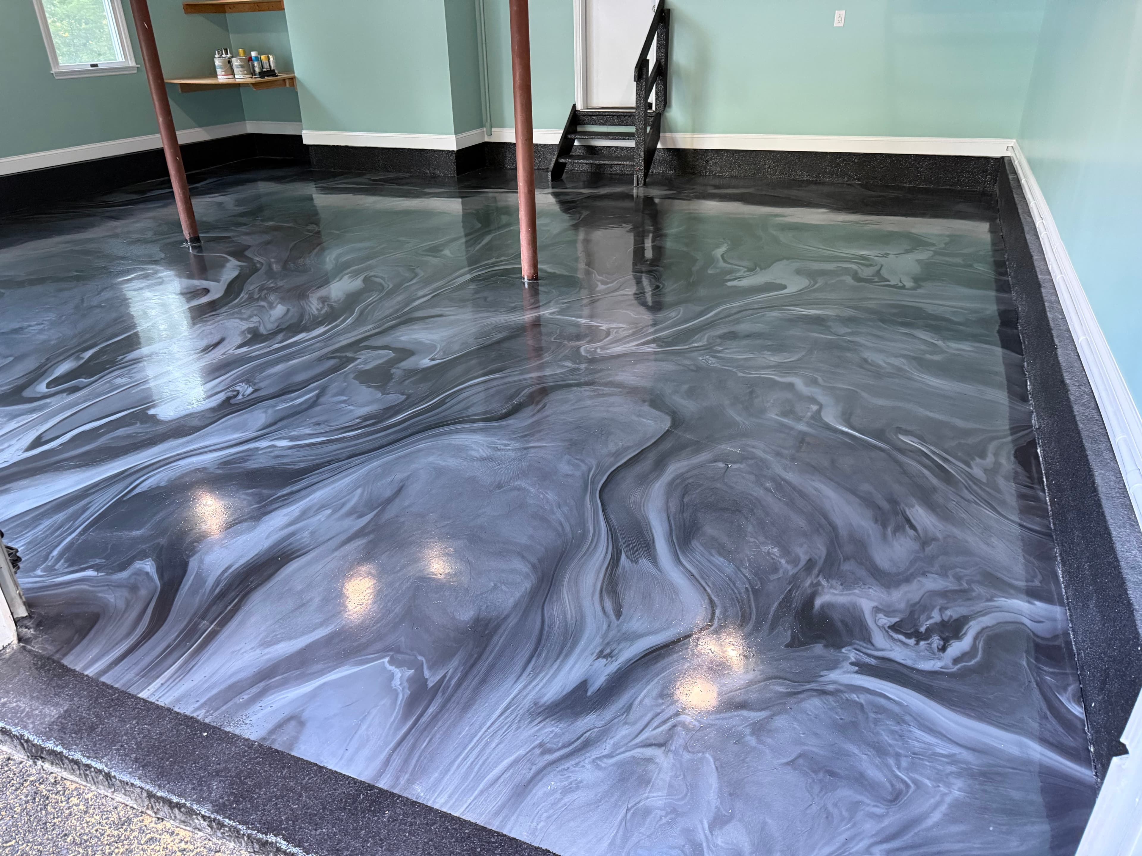 Epoxy garage floor and matching flake epoxy apron for a home golf simulator space in Chester, NY