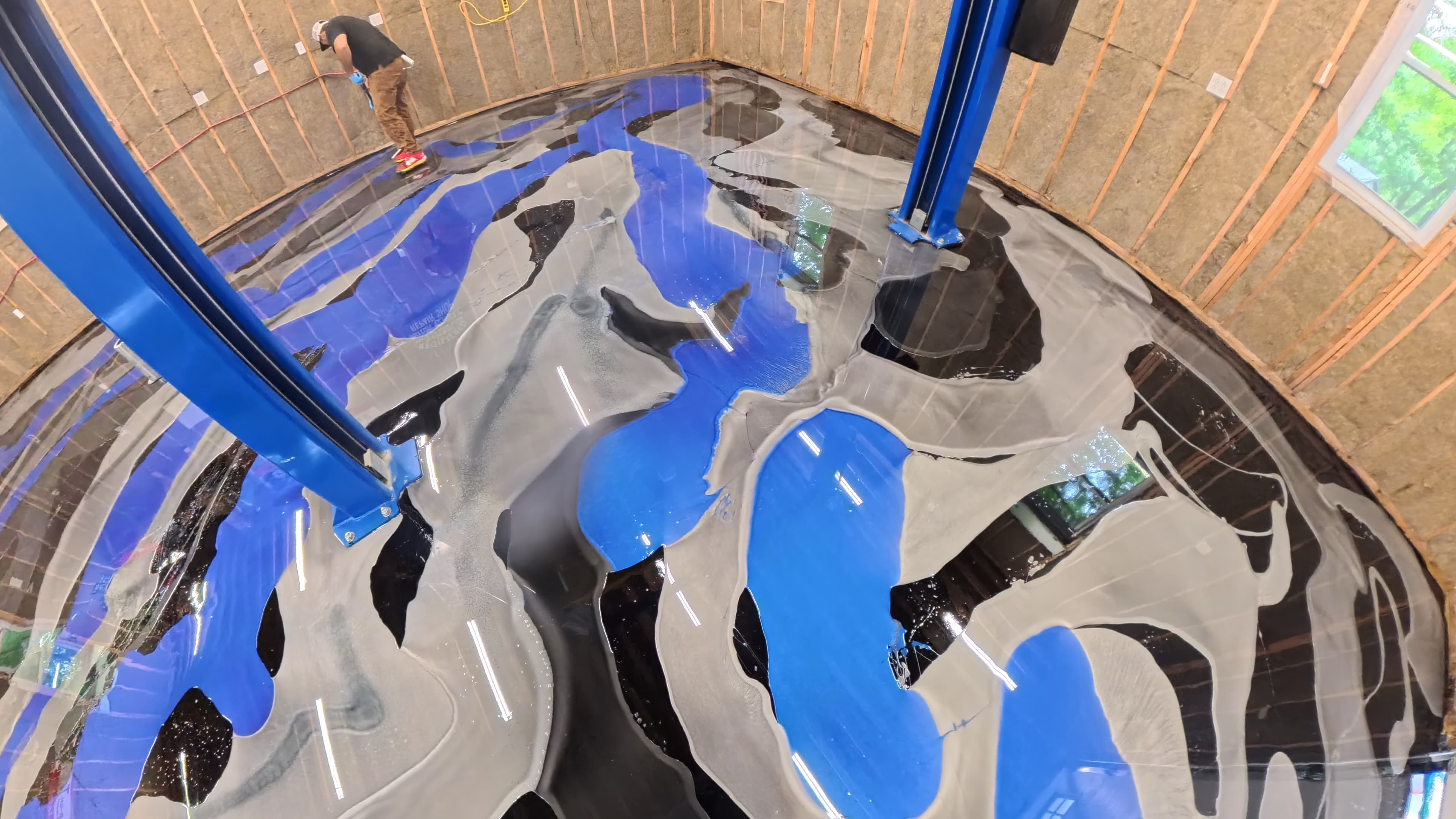 Crew blending epoxy colors around the vehicle lifts in Kerhonkson, NY