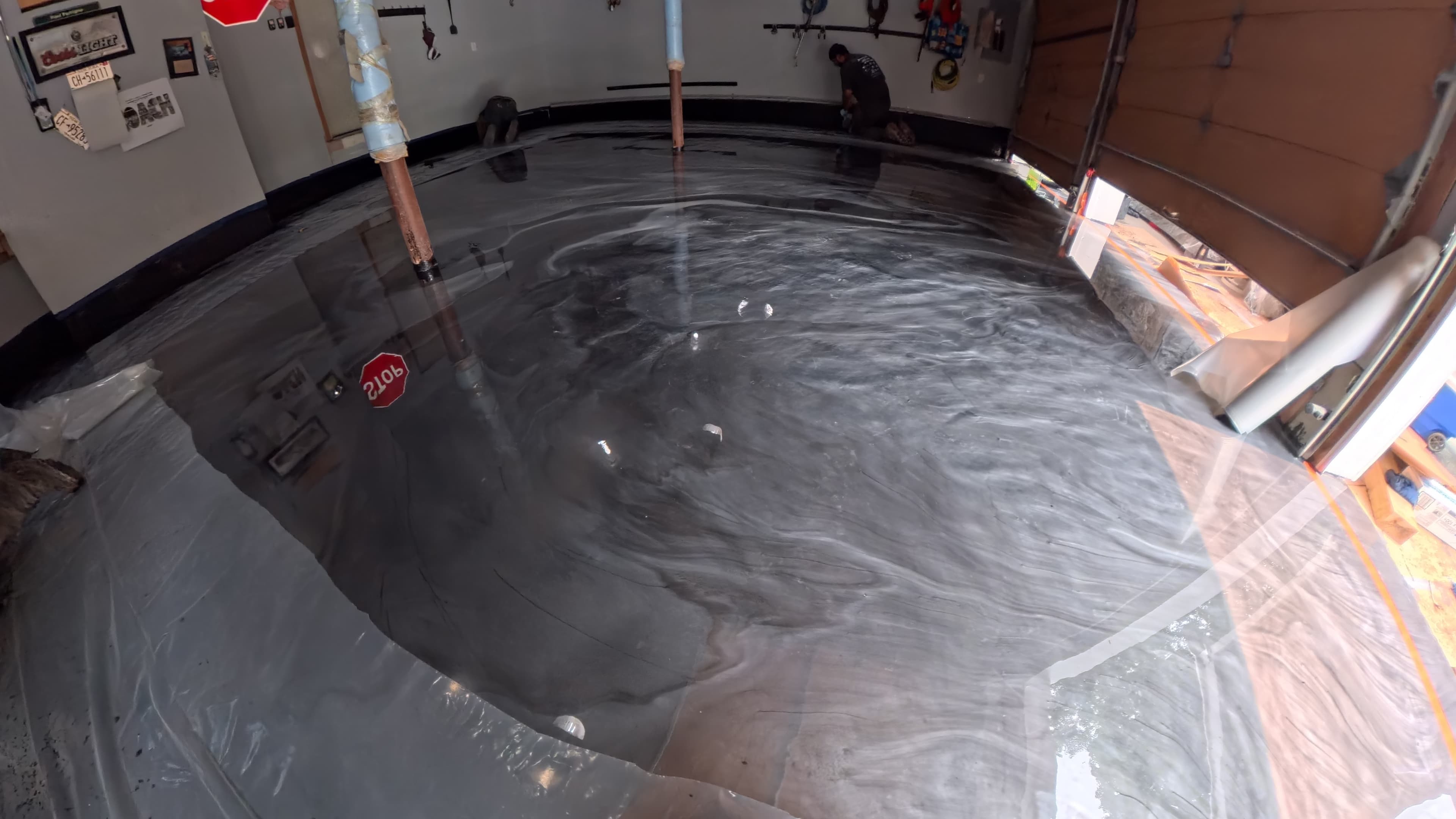 Custom epoxy garage floor curing during installation in Chester, NY
