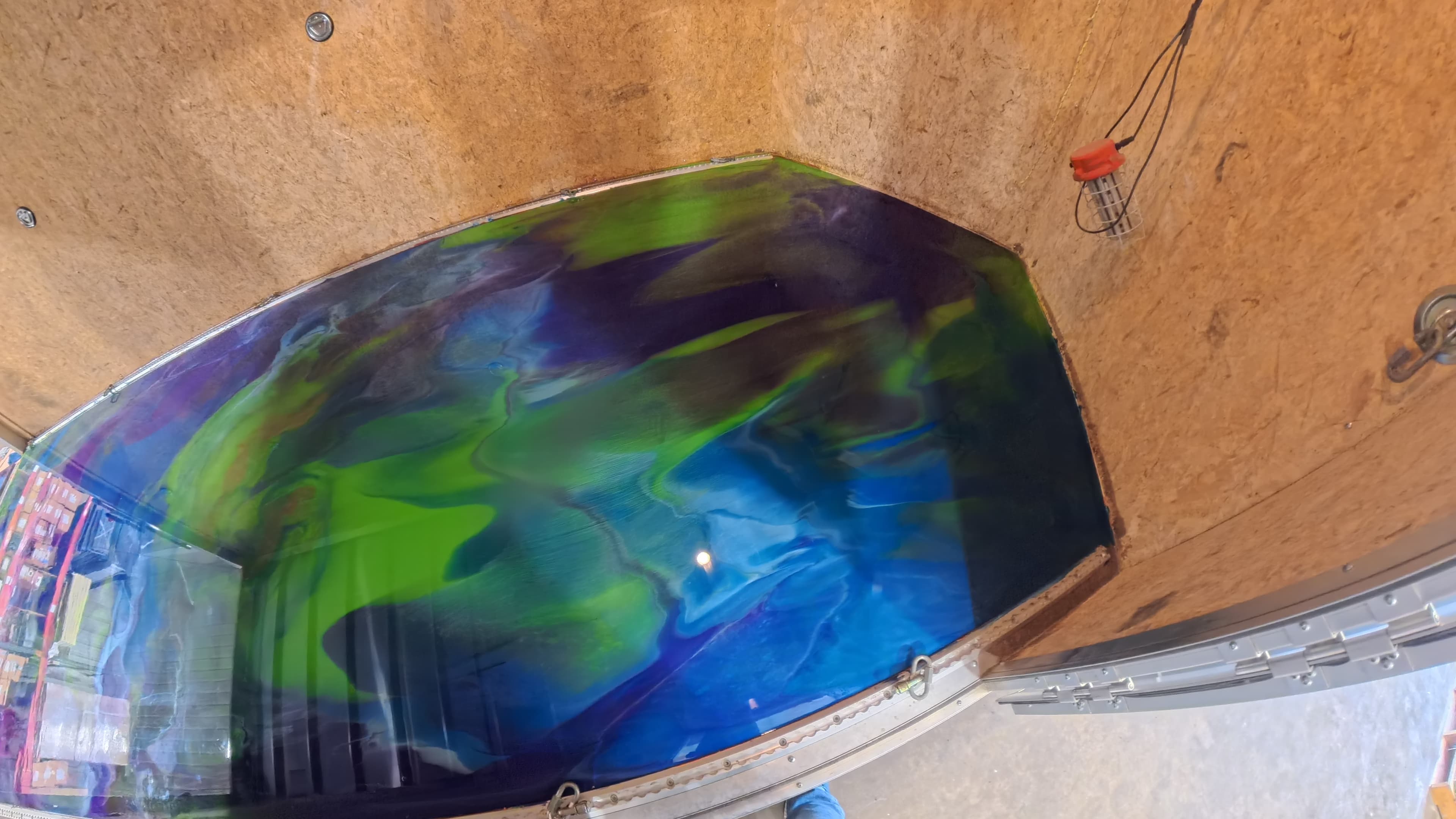 Close-up of the custom swirl epoxy trailer floor in Bullville, NY